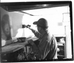 John Allen painting the backdrop for the G&D
