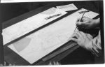 John Allen's hands drawing the plans for the G&D